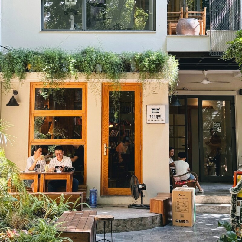 a group of people sitting outside of a building